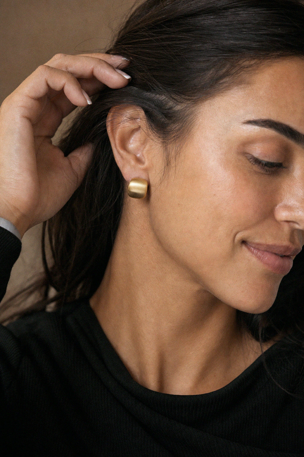 Ayla Satin Huggies in 18k gold worn on the ear